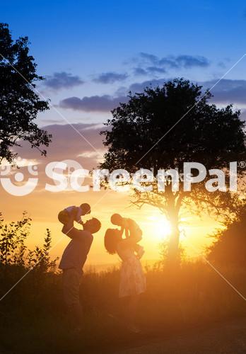 Joyful Family Enjoying Quality Time Outdoors In Beautiful Natural Surroundings.